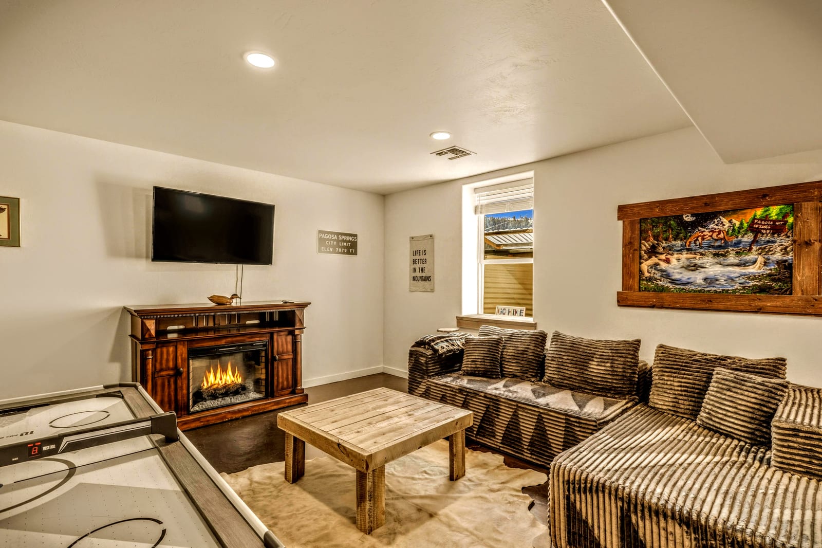 Game room with retro gaming, air hockey, ping-pong